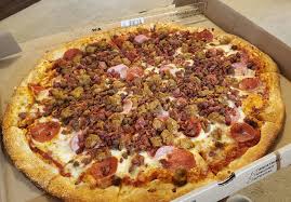 Big Pie In The Sky Pizzeria signature dishes Bacon Cheeseburger Pizza
West Coast Pesto
The Carnivore Pizza